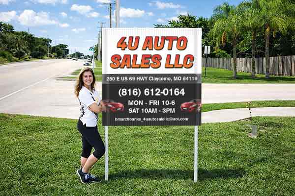 4x4 auction sign with metal post kit installed outdoors