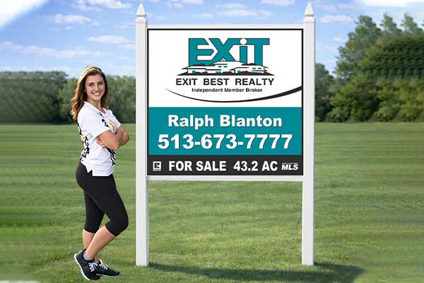 4x4 EXIT Realty sign mounted with PVC post kit