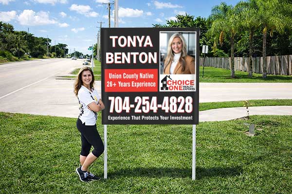 4x4 realtor sign with patented post pockets and metal post kit installed outdoors